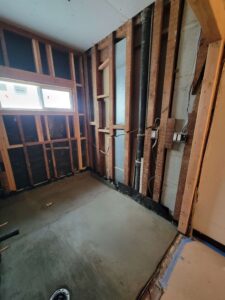Early cable runs for for recessed lighting and outlets; new construction vinyl window installation and framing