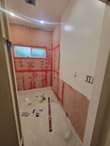 Hardy backer, drywall paint, and waterproof membrane installed