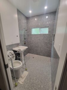 Finished product: wheelchair-accessible shower, toilet, and sink